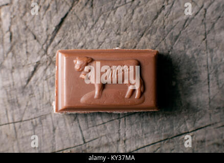 DORKOVO, BULGARIA - FEBRUARY 10, 2017: : close-up chocolate bar Milka old wooden background, alpine milk chocolate. Illustrative editorial Stock Photo