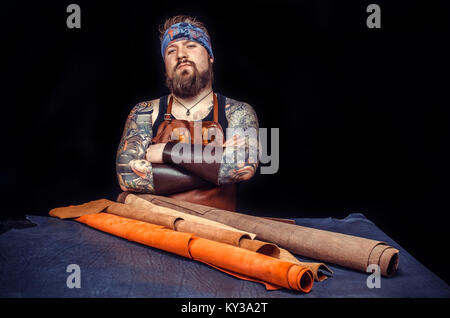 Tanner performs leather working for a new product Stock Photo