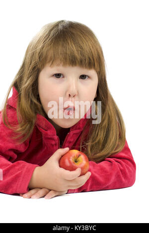 Cheerful kid holding apple with funny face isolated on white Stock Photo