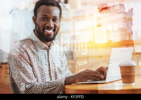 Portrait of delighted worker that posing on camera Stock Photo