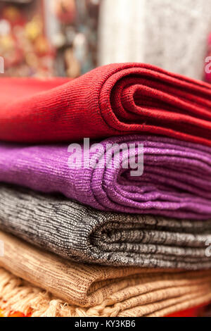 colorful covers for pillows on stack, close up Stock Photo
