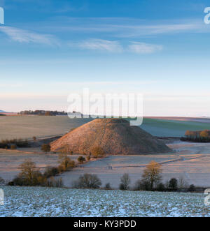 Silbury Hill in the winter at sunrise. Avebury, Wiltshire, England Stock Photo