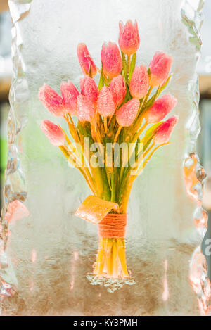 Decorative bunch of tulips in ice Stock Photo