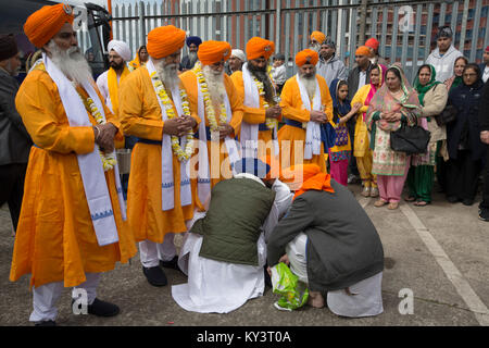 Sikhs preparing at their temple in Leicester, England before a bi-annual procession through the city's streets. According to the 2011 census, there were 14,500 people of the Sikh faith living in Leicester,  around five per cent of the local population. The local football club, Leicester City, were on the brink of being surprise winners of the English Premier League in the 2015-16 season. Stock Photo