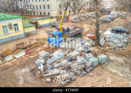 MOSCOW, RUSSIA - November 04.2017: Team of construction workers loads in car building blocks Stock Photo