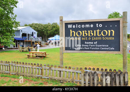 Hobbiton movie set visitor attraction in farmland near Matamata New Zealand. Visitor Centre sign and building. Space for copy