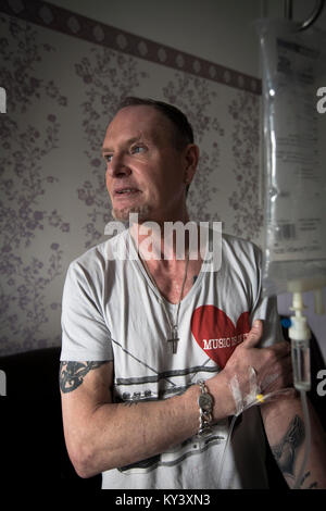 Former international footballer Paul 'Gazza' Gascoigne undergoing a nutrient infusion at Cassiobury Court, a drug and alcohol rehabilitation clinic in Watford, England. The pioneering protocol, involving a product known as NAD+, helps repair the brain and body has been introduced to the United Kingdom by John Gillen, managing director of London-based firm Bionad Ltd. Patients undergo several infusions, which can take up to several hours to complete, under medical supervision at the clinic. Stock Photo