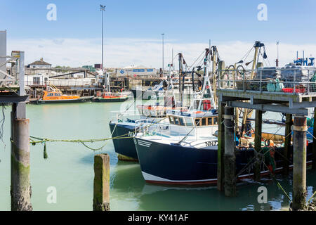 Fishing boats moored on River Ouse, West Quay, Newhaven, East Sussex, England, United Kingdom