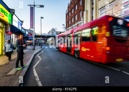 Street scene in Peckham, London, with red bus Stock Photo