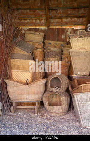 Different history wicker baskets in the old barn Stock Photo