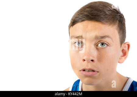 Teenage boy headshot looking scared agaisnt a white background Stock Photo