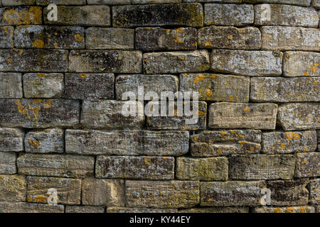 old weathered dry stone wall covered with lichens, UK Stock Photo
