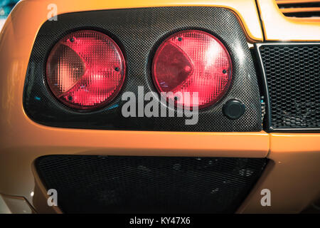 Rear lights on a luxury yellow Italian sports car, close up photo Stock Photo