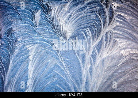 Frost on car windscreen showing feathery ice crystal formation Stock Photo