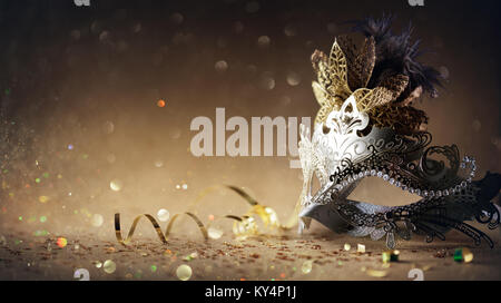 Venetian Mask On Dark Golden Background - Carnival Party Stock Photo