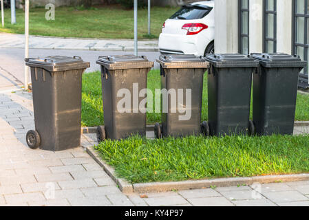 Some waste barrel at the roadside Stock Photo