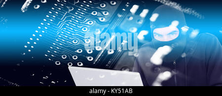 Composite image of hacker in balaclava hacking a laptop Stock Photo