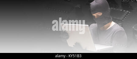 Composite image of hacker using laptop to steal identity Stock Photo