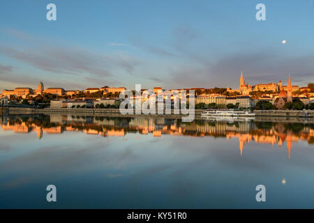 Buda side of Budapest city reflecting in still river Stock Photo