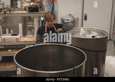 Female worker using digital tablet Stock Photo