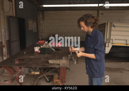 Female worker working in the workshop Stock Photo