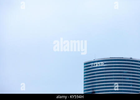 PARIS, FRANCE - DECEMBER 20, 2017: EDF logo on their main office in La Defense district. Electricite de France (EDF) is the main French electric utili Stock Photo