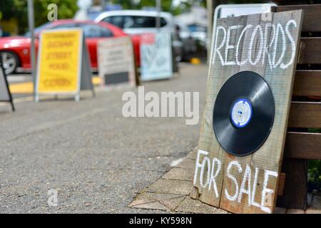 Records for sale sign in the main street of Maleny, Queensland, Australia Stock Photo