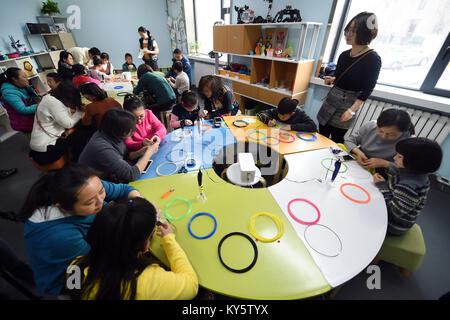 Lanzhou, China's Gansu Province. 13th Jan, 2018. Children create artworks with 3D printing pens in the Chengguan District of Lanzhou, capital of northwest China's Gansu Province, Jan. 13, 2018. Children in Lanzhou took part in creative education class during their winter vacation. Credit: Fan Peishen/Xinhua/Alamy Live News Stock Photo