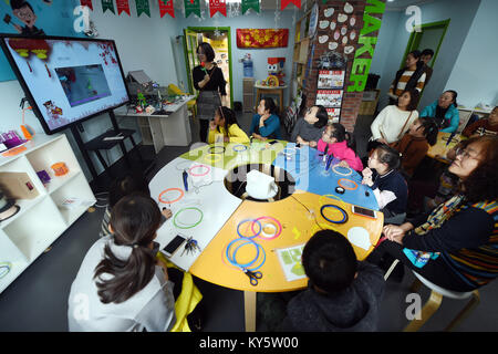 Lanzhou, China's Gansu Province. 13th Jan, 2018. Children watch teaching video about 3D printing pen in the Chengguan District of Lanzhou, capital of northwest China's Gansu Province, Jan. 13, 2018. Children in Lanzhou took part in creative education class during their winter vacation. Credit: Fan Peishen/Xinhua/Alamy Live News Stock Photo