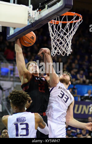Seattle, WA, USA. 13th Jan, 2018. Stanford's Reid Travis (22) is fouled by UW center Sam Timmins (33) during a PAC12 basketball game between the Washington Huskies and Stanford Cardinal. The Cardinal won the game 73-64. The game was played at Hec Ed Pavilion in Seattle, WA. Jeff Halstead/CSM/Alamy Live News Stock Photo