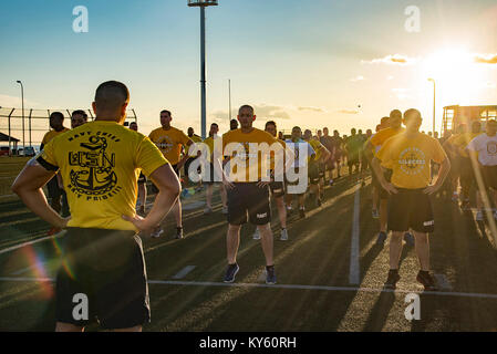 YOKOSUKA, Japan (Sept. 13, 2017) Chief Petty Officers and Chief Petty Officer Selectees from Yokosuka area commands conduct warm up exercises during a physical training (PT) session with Master Chief Petty Officer of the Navy Steven S. Giordano at Berkey Field onboard Commander Fleet Activities Yokosuka. In addition to PT, Giordano had lunch with Sailors at the base galley and held an all hands call at the Fleet Theater. (U.S. Navy Stock Photo