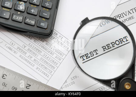 Closeup of magnifying glass on test report with laboratory documents. For research and laboratory, science and technology, or medical concepts. Stock Photo