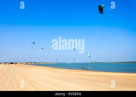 KALPITIYA, SRI LANKA - FEBRUARY 09, 2017: Kitesurfers at the Kalpitiya beach in Sri Lanka. Kalpitiya is the best kitesurfing destination in Asia. Stock Photo