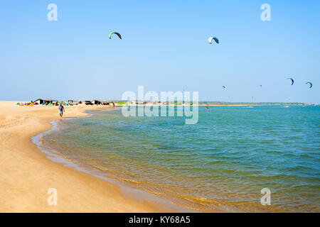 KALPITIYA, SRI LANKA - FEBRUARY 09, 2017: Kitesurfers at the Kalpitiya beach in Sri Lanka. Kalpitiya is the best kitesurfing destination in Asia. Stock Photo