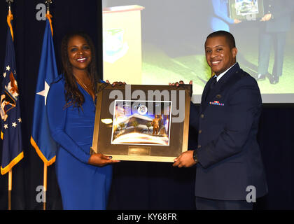 Malissia R. Clinton Senior Vice President, General Counsel and Secretary at the Aerospace Corporation and guest speaker at the U.S. Air Force Space and Missile Systems Center's Dr. Martin Luther King luncheon at Los Angeles Air Force Base, is presented a framed image by Air Force 1st Lt. Stephen Hartfield in El Segundo, Calif., Jan.10, 2018.  This year’s theme was 'The Time is Always Right to do What is Right.'  (U.S. Air Force Stock Photo