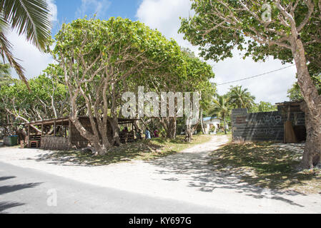 TADINE,MARE,NEW CALEDONIA-DECEMBER 3,2016: Local market food vendors with rustic architecture by Yejele Beach in Mare, New Caledonia Stock Photo