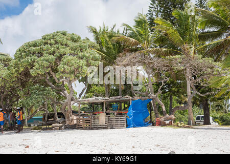 TADINE,MARE,NEW CALEDONIA-DECEMBER 3,2016: Food and drink vendor with rustic architecture and lush flora at Yejele Beach in Mare, New Caledonia Stock Photo