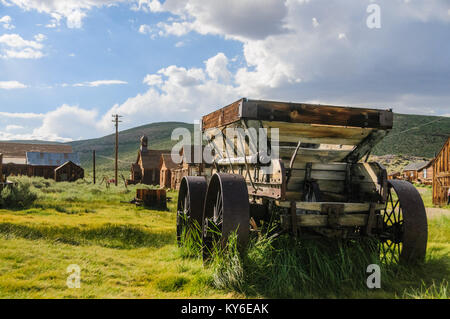 An old wooden wagon with rusty iron wheels in the the American Ghost town of Bodie. Stock Photo