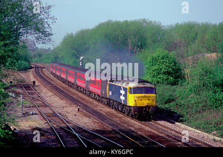 A class 47 diesel locomotive number 47847 working a Virgin Cross Country service passing Hinksy Yard near Oxford. 23rd April 2002. Stock Photo