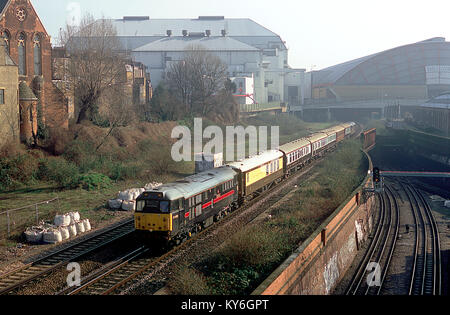 A pair of class 31 diesel locomotives numbers 31468 and 31452 owned by Fragonset Railways are top and tailing a charter train at Earles Court. 22nd February 2003. Stock Photo