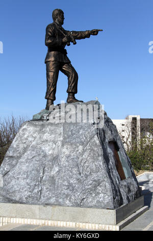 Bronze solger on the rock in War museum in Hamedan, Iran Stock Photo