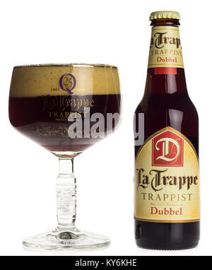 Bottle and glass of La Trappe Dubbel beer isolated on a white background Stock Photo