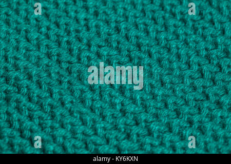 Macro color image of green knitted texture. Stock Photo