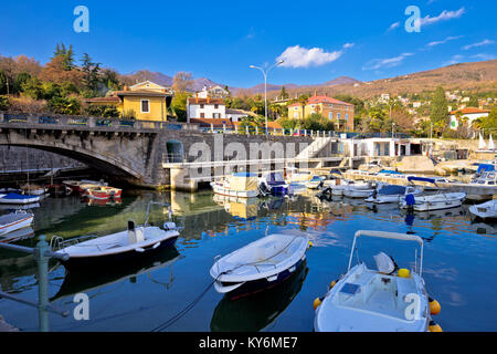 Icici village waterfront and harbor in Opatija riviera, turquoise sea and blue sky, Kvarner, Croatia Stock Photo