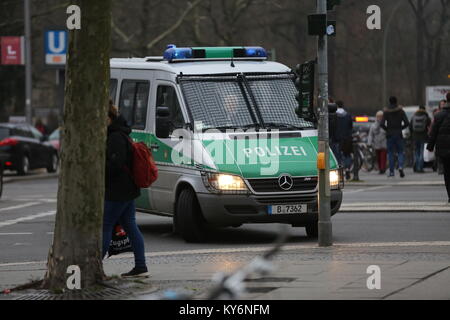 Berlin, Germany. 12th Jan, 2018. A traffic light indicates 'yellow' in