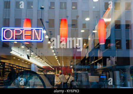Neon sign advertising fresh coffee at a delicatessen in New York on Sunday, USA. Stock Photo