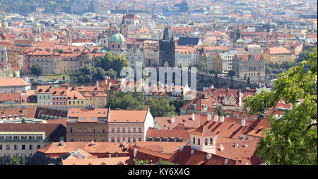 Prague, Czech Republic - August 24, 2016: Panoramic view with Charles Bridge and many houses and monument Stock Photo