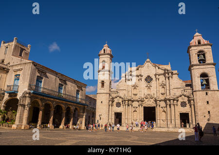 Havana, Cuba - December 3, 2017: Square and Cathedral Church of Havana (Cuba) and tourists and faithful in a December Sunday Stock Photo