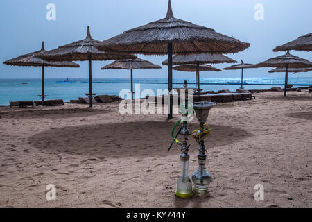 Two shisha hookahs on the sandy beach of Red Sea in Sharm El Sheikh, Egypt. Stock Photo