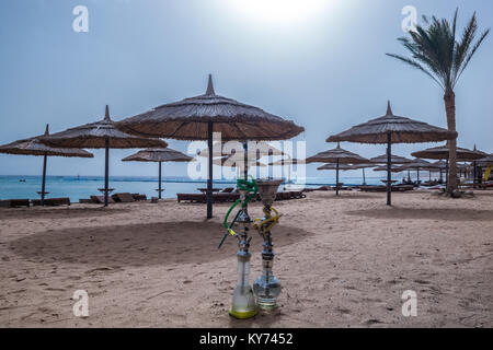 Two shisha hookahs on the sandy beach of Red Sea in Sharm El Sheikh, Egypt. Stock Photo